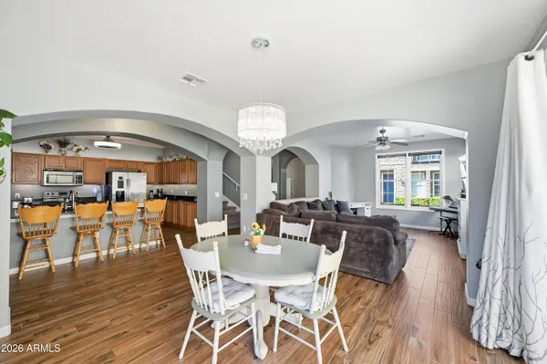 a view of a dining room with furniture window and wooden floor