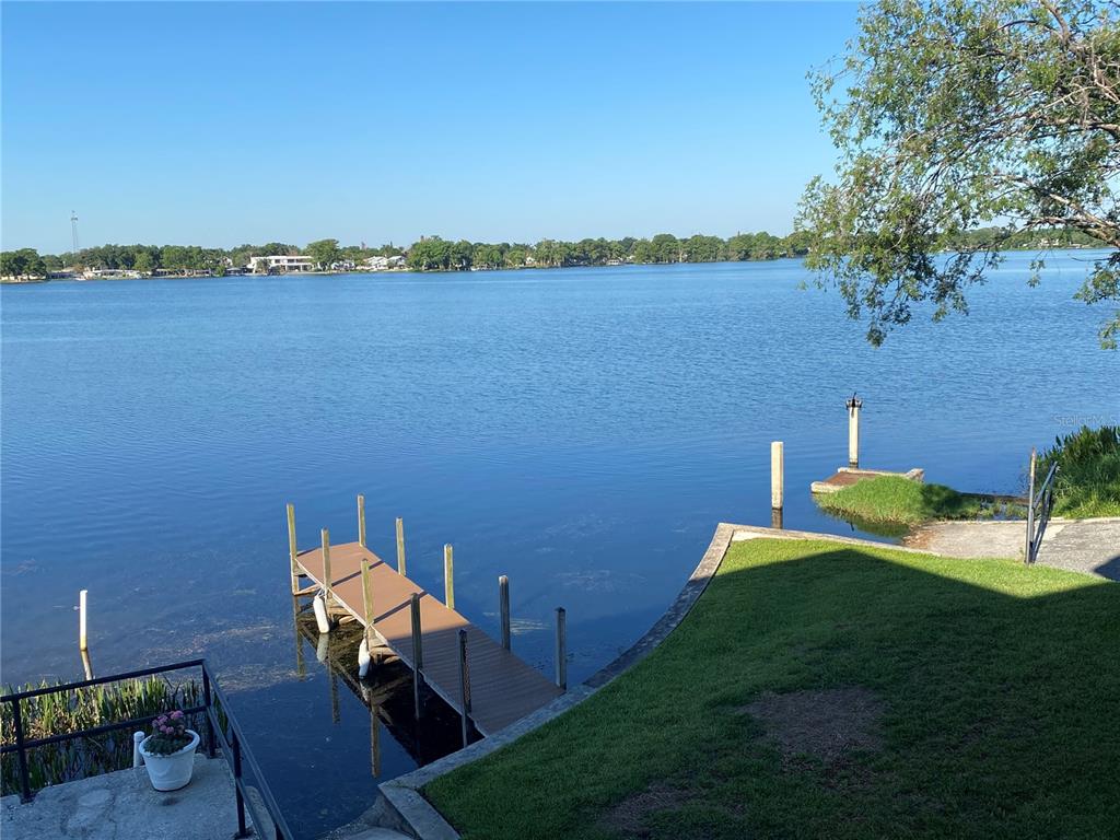 1500 Gay Road, Unit 17D Winter Park, FL 32789 - Photo 29 of 34 a view of a lake with table and chairs