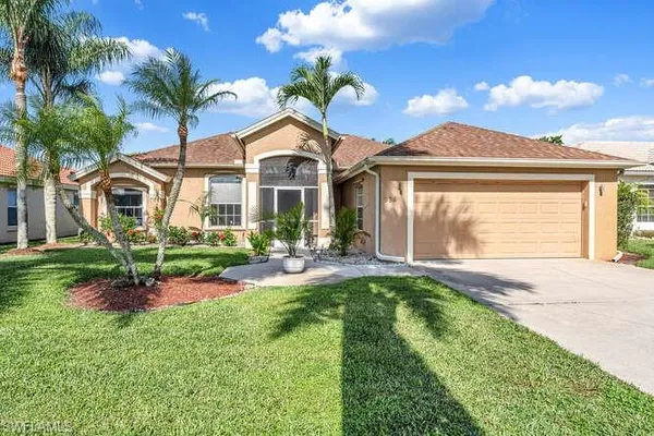 a front view of a house with a yard and porch