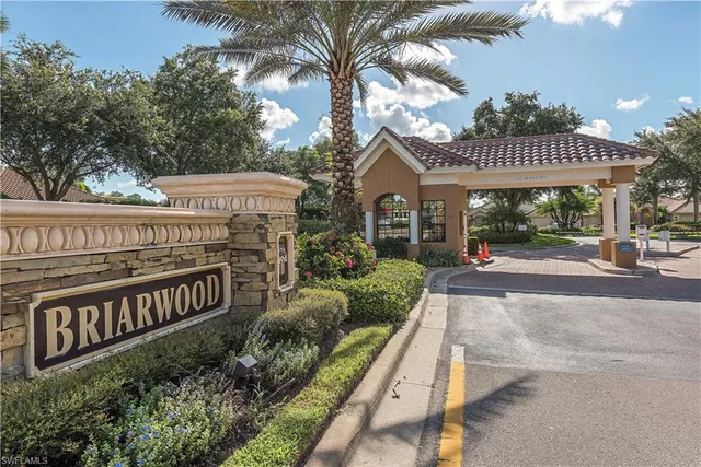 an aerial view of a houses with a yard