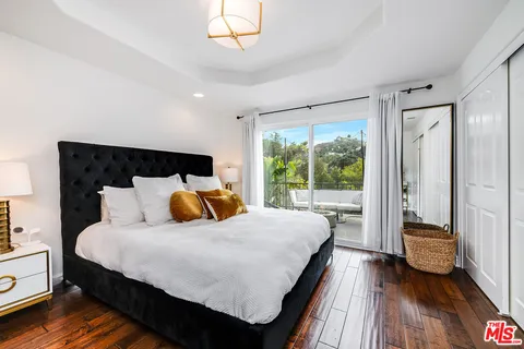 a living room with furniture fireplace and flat screen tv