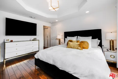 a living room with furniture ceiling fan and a rug