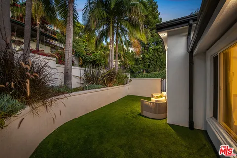 a outdoor space with patio the couches and a potted plant