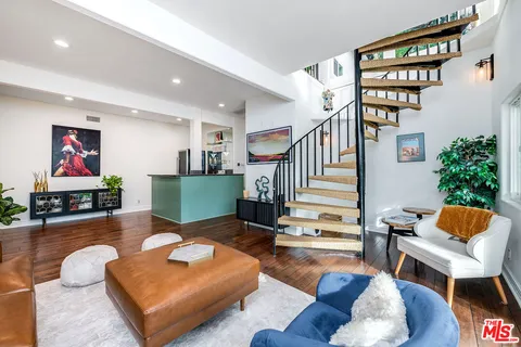 a backyard of a house with lots of green space and garden