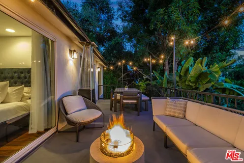 a bathroom with a double vanity sink toilet and shower