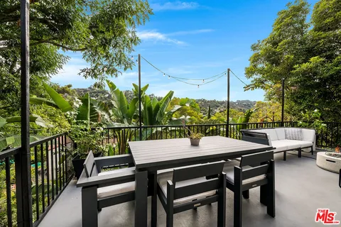 a room with furniture and a potted plant