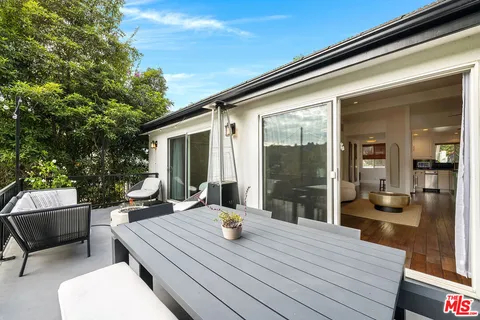 a workspace with furniture window and wooden floor