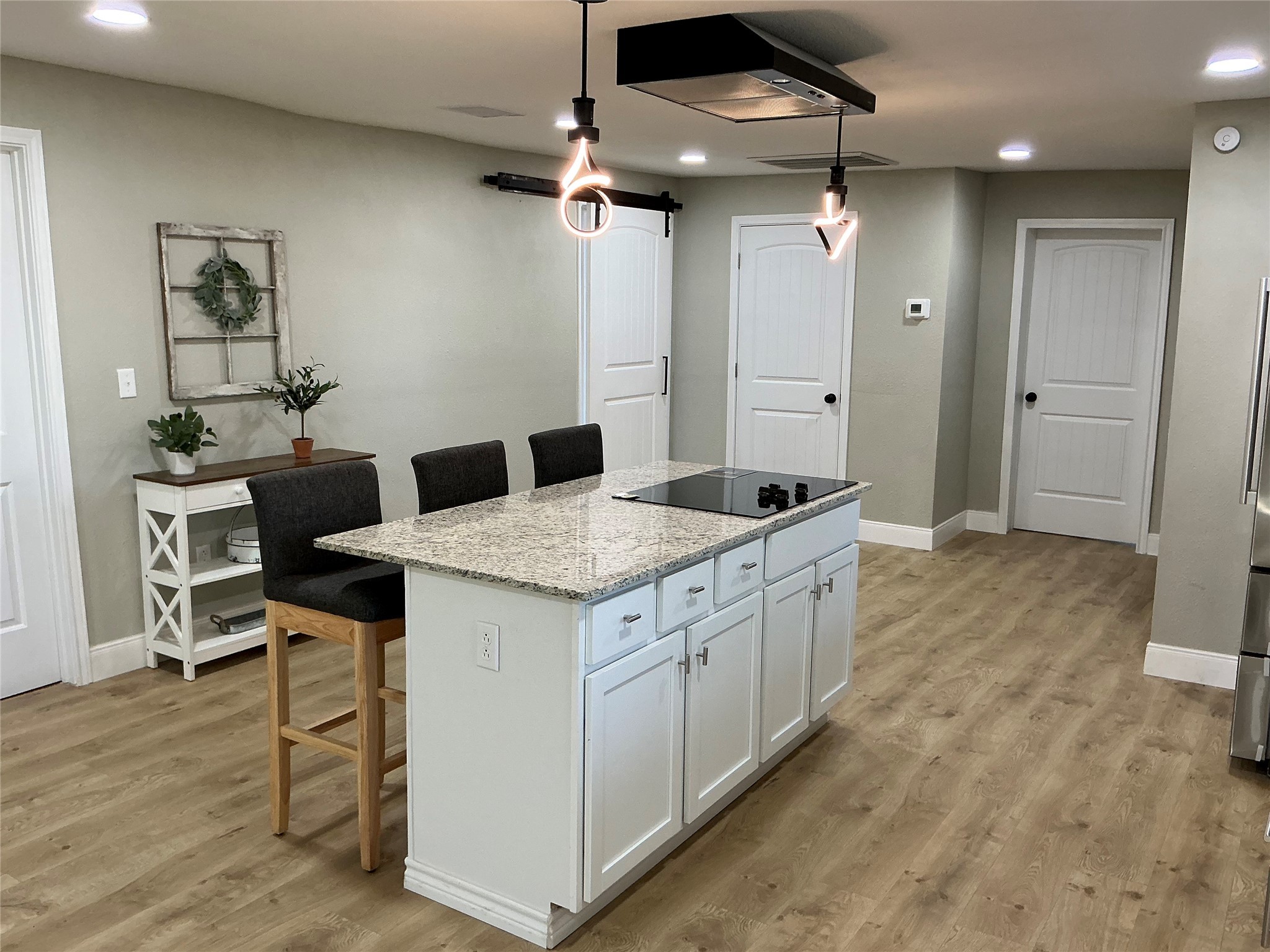 10928 L And M Road Montgomery, TX 77316 - Photo 12 of 31 a kitchen with a sink cabinets and wooden floor