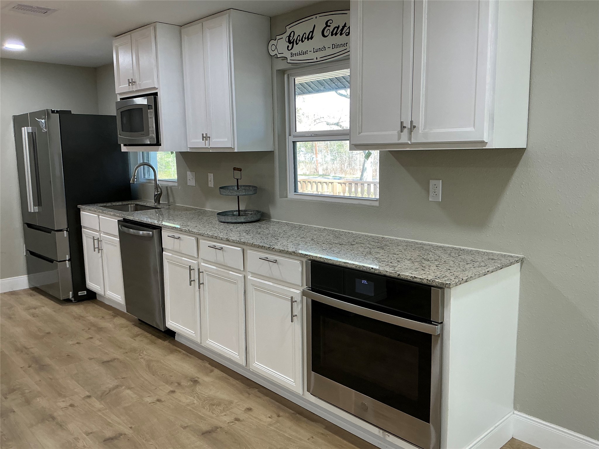 10928 L And M Road Montgomery, TX 77316 - Photo 13 of 31 a kitchen with stainless steel appliances granite countertop a stove a refrigerator and a sink