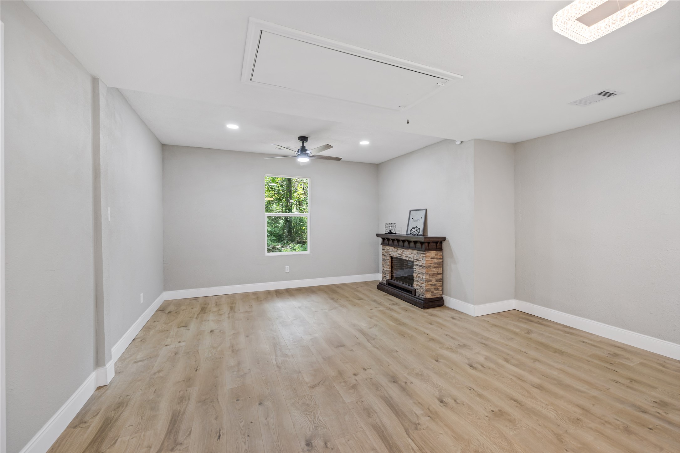 10928 L And M Road Montgomery, TX 77316 - Photo 14 of 31 wooden floor in an empty room with a window