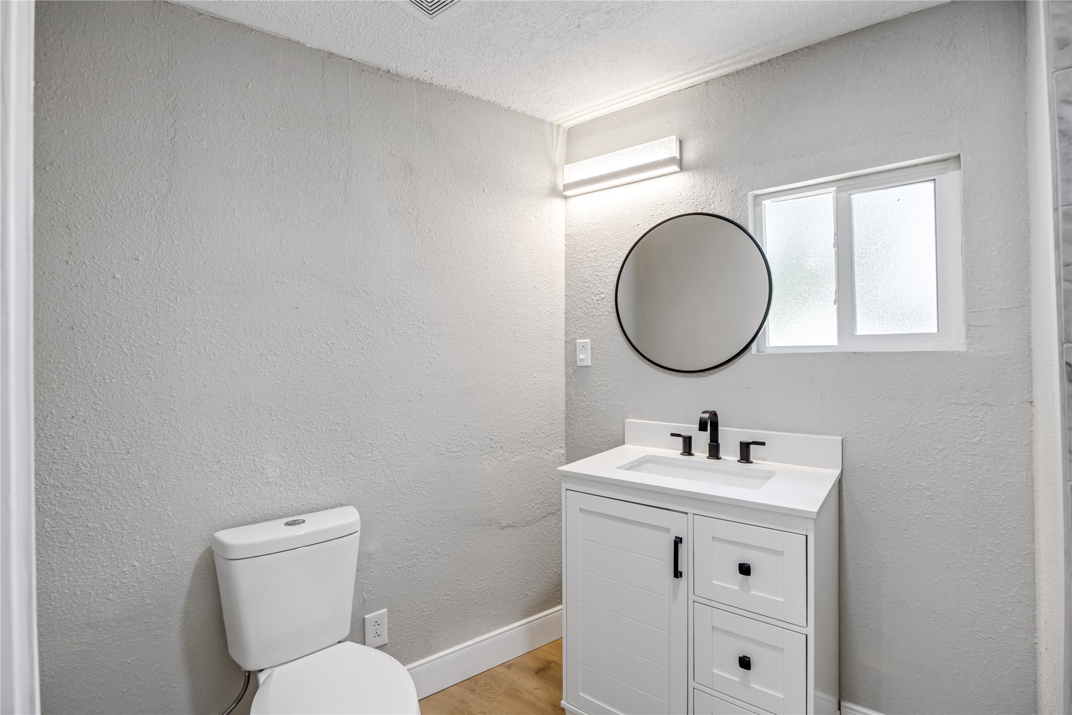10928 L And M Road Montgomery, TX 77316 - Photo 15 of 31 a bathroom with a toilet sink and mirror