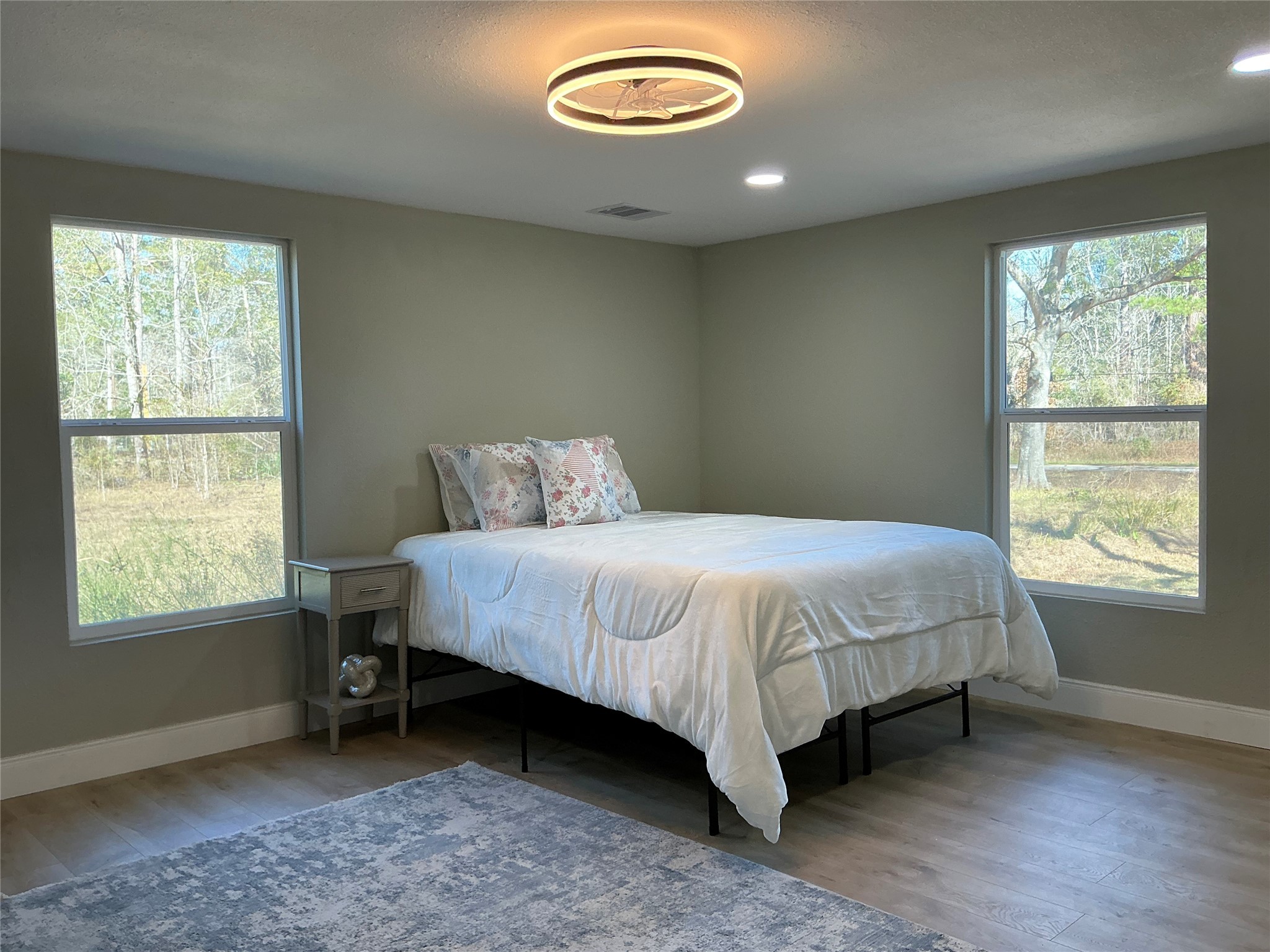 10928 L And M Road Montgomery, TX 77316 - Photo 17 of 31 a bedroom with a bed and a window