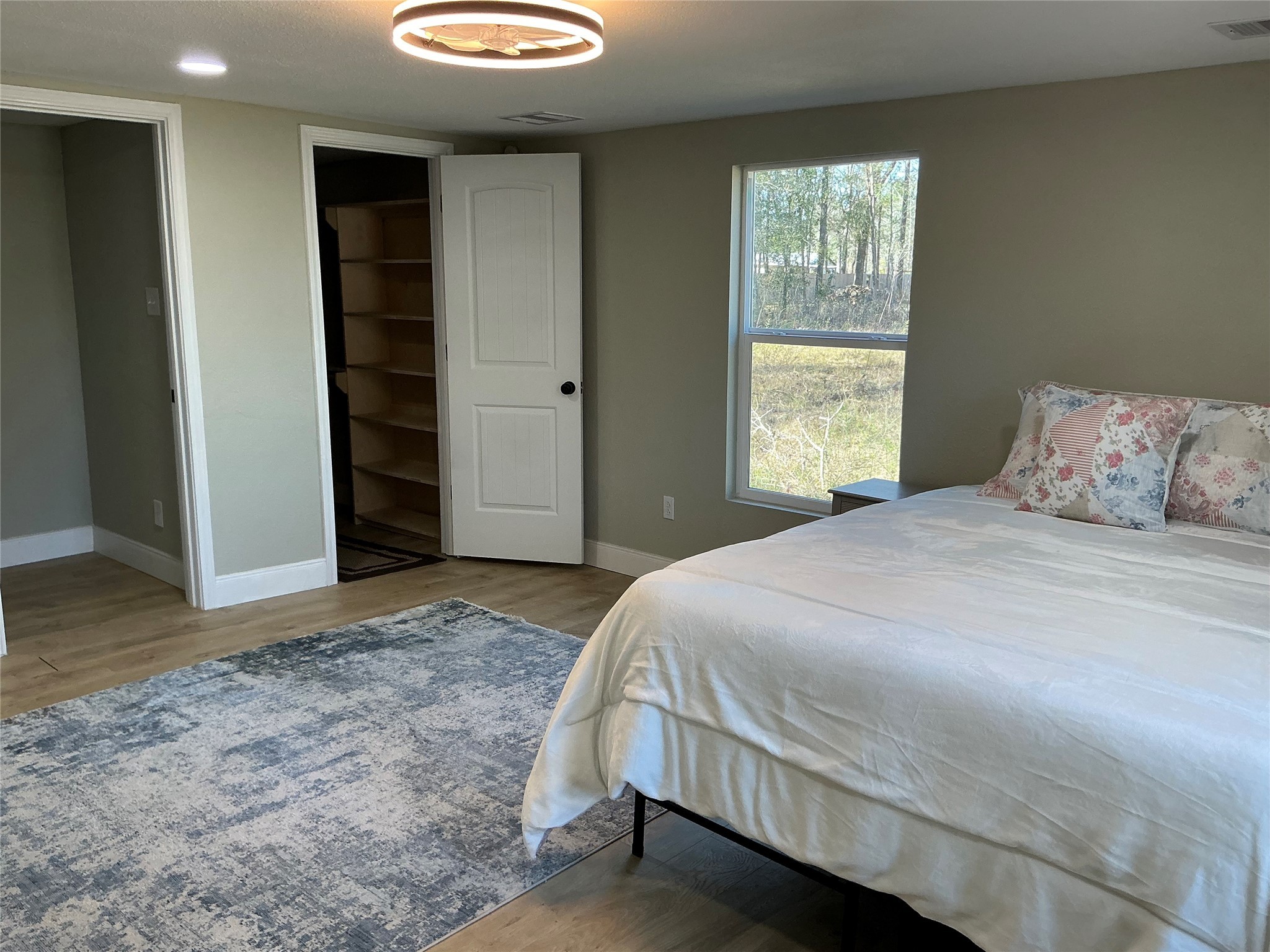 10928 L And M Road Montgomery, TX 77316 - Photo 18 of 31 a bedroom with a bed and a window