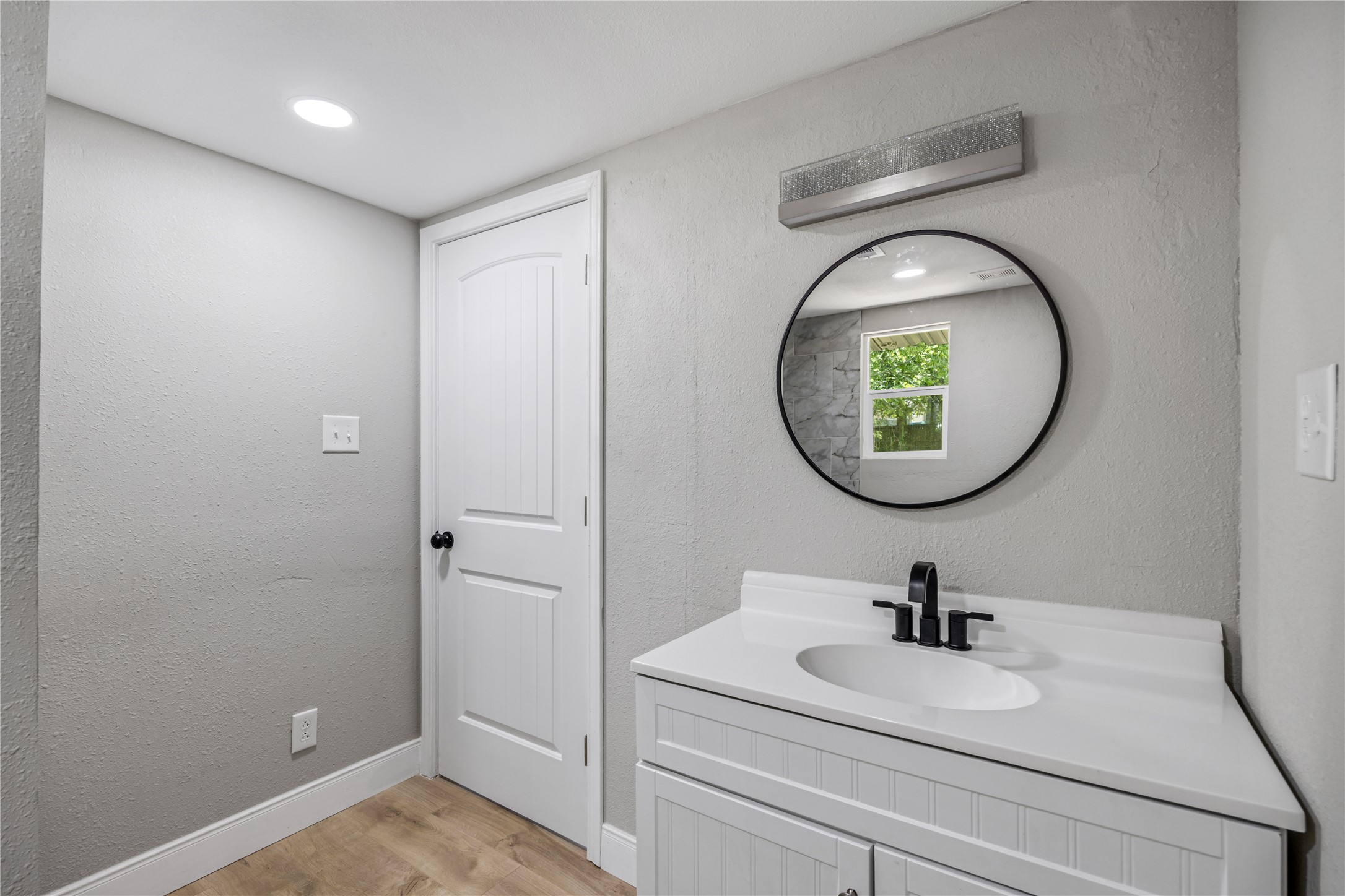 10928 L And M Road Montgomery, TX 77316 - Photo 24 of 31 a bathroom with a sink and a mirror