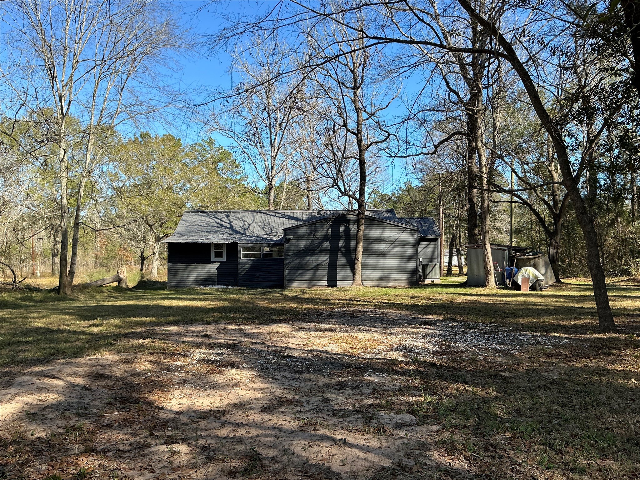 10928 L And M Road Montgomery, TX 77316 - Photo 25 of 31 a big house with trees in the background