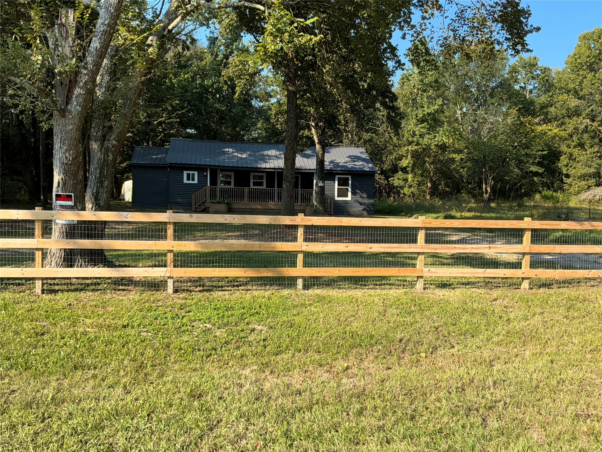 10928 L And M Road Montgomery, TX 77316 - Photo 5 of 31 a view of a swimming pool with trees in the background