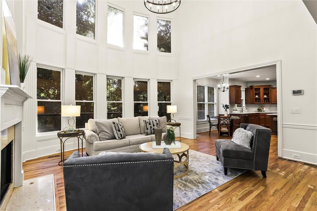 3184 Isleworth Trace Duluth, GA 30097 - Photo 11 of 75 a living room with furniture and a fireplace