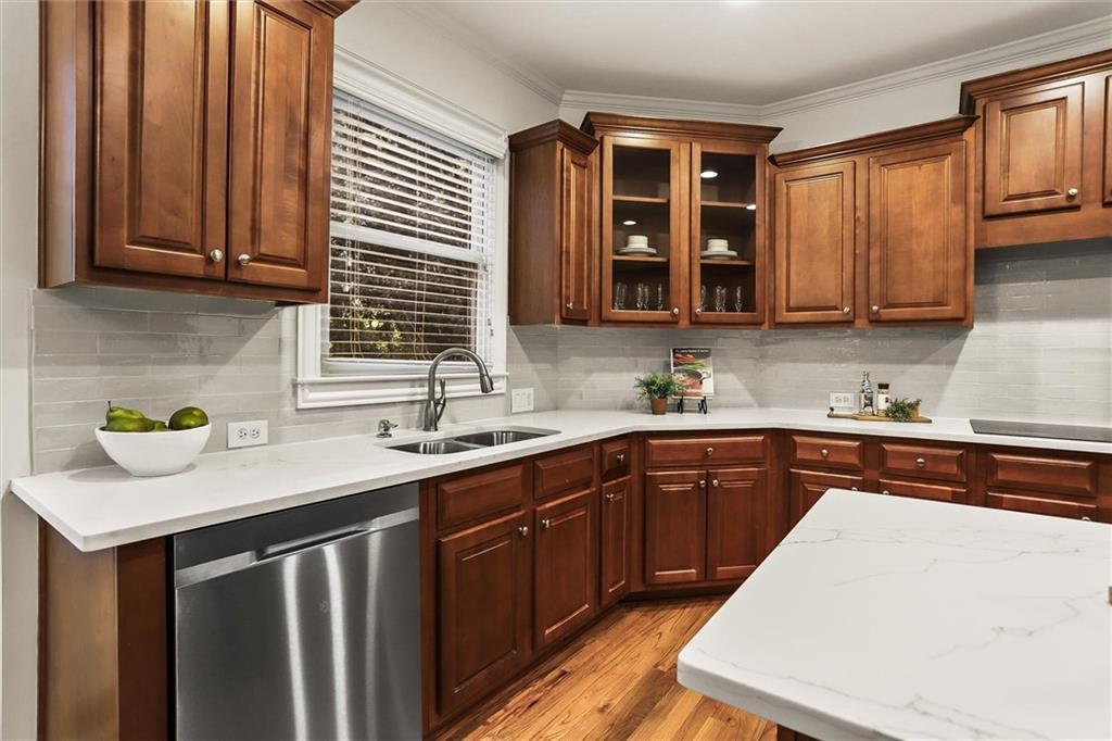 3184 Isleworth Trace Duluth, GA 30097 - Photo 17 of 75 a kitchen with stainless steel appliances granite countertop a sink stove and cabinets