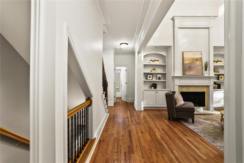 3184 Isleworth Trace Duluth, GA 30097 - Photo 19 of 75 a view of a livingroom with furniture wooden floor staircase and windows