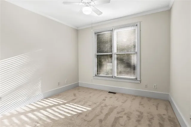a en suite bathroom with a sink mirror and shower