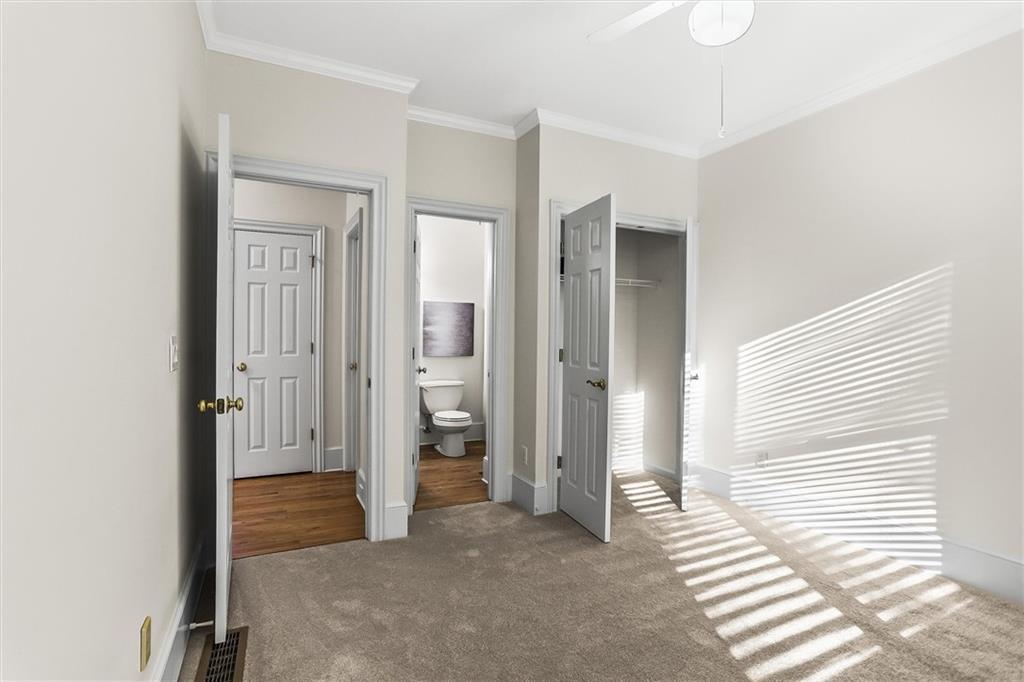 3184 Isleworth Trace Duluth, GA 30097 - Photo 23 of 75 a view of a livingroom with wooden floor and a bathroom