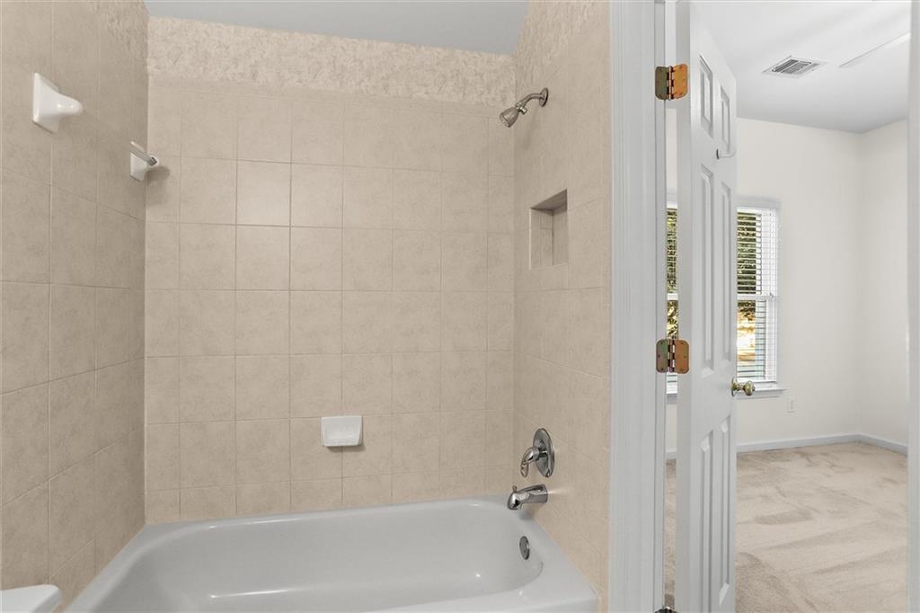 3184 Isleworth Trace Duluth, GA 30097 - Photo 31 of 75 a bathroom with a shower
