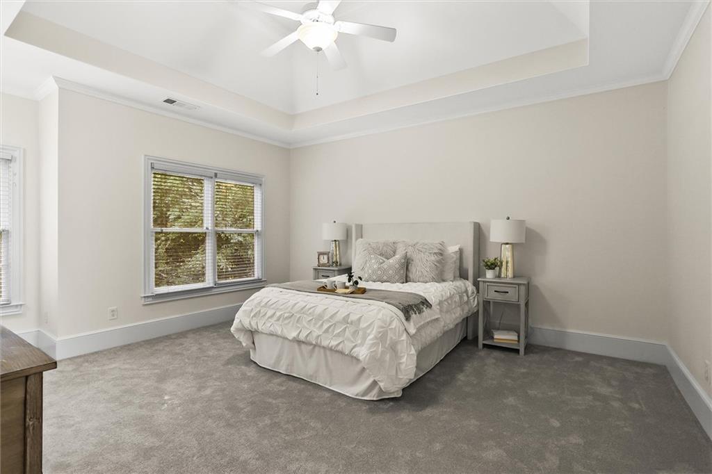 3184 Isleworth Trace Duluth, GA 30097 - Photo 32 of 75 a spacious bedroom with a bed and a window