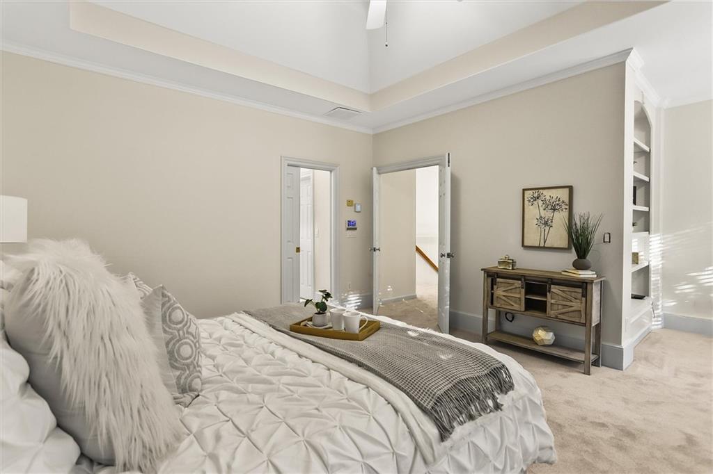 3184 Isleworth Trace Duluth, GA 30097 - Photo 34 of 75 a bedroom with a bed and a dresser