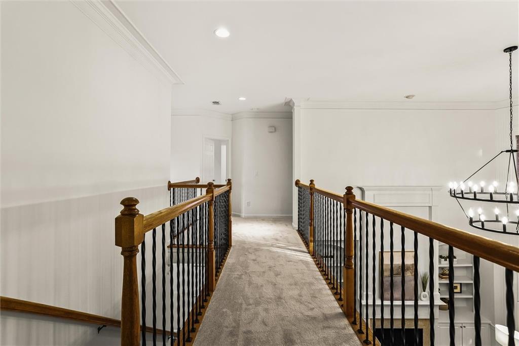 3184 Isleworth Trace Duluth, GA 30097 - Photo 43 of 75 a view of a hallway with wooden floor