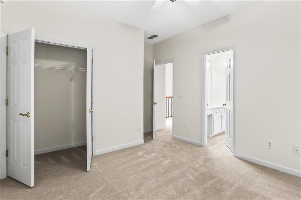3184 Isleworth Trace Duluth, GA 30097 - Photo 50 of 75 an empty room with closet and a bathroom