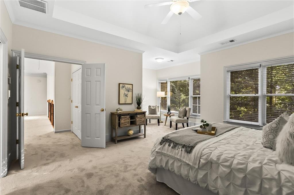 3184 Isleworth Trace Duluth, GA 30097 - Photo 5 of 75 a spacious bedroom with a bed and a large window