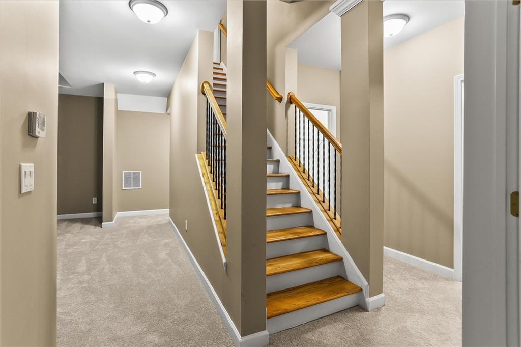 3184 Isleworth Trace Duluth, GA 30097 - Photo 54 of 75 a view of a hallway with staircase