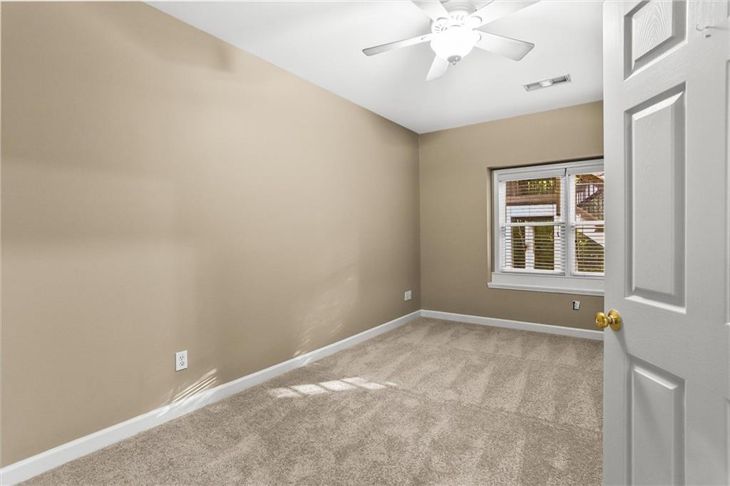 3184 Isleworth Trace Duluth, GA 30097 - Photo 58 of 75 a view of an empty room with a window
