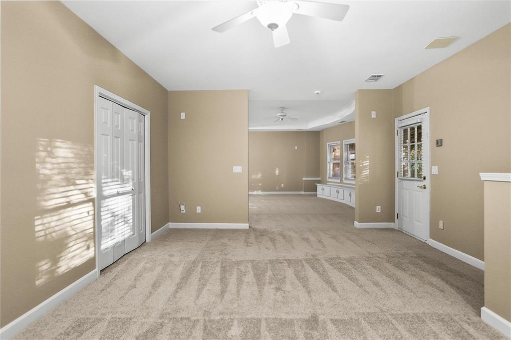 3184 Isleworth Trace Duluth, GA 30097 - Photo 65 of 75 a view of an empty room with a window