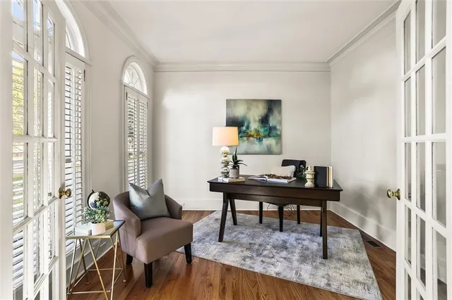 a kitchen with stainless steel appliances granite countertop a refrigerator a sink dishwasher a stove with wooden cabinets and floor