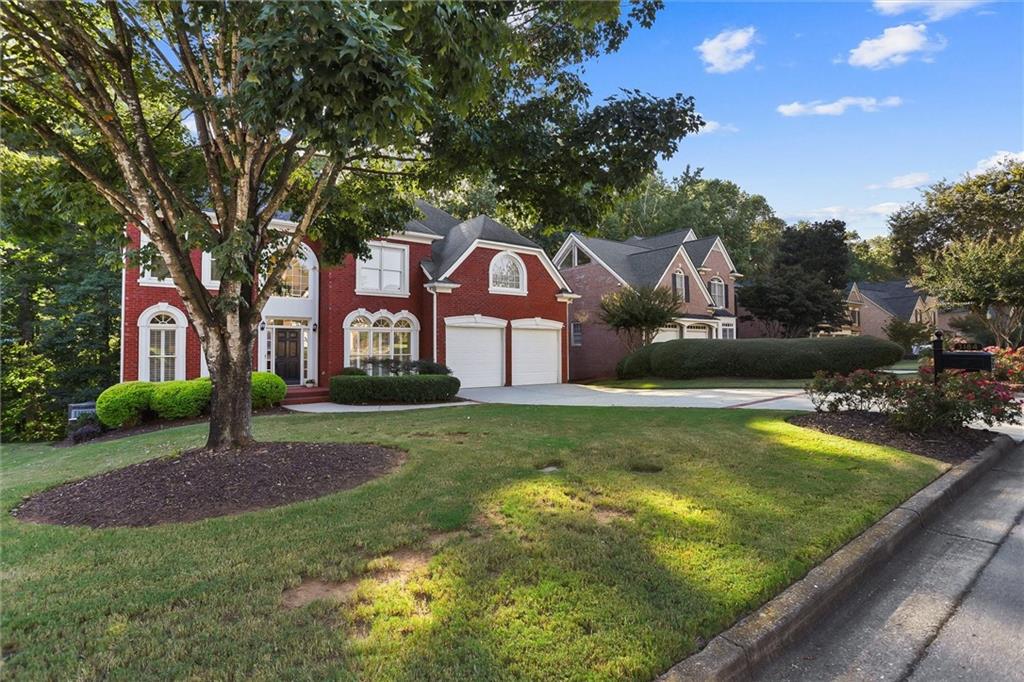 3184 Isleworth Trace Duluth, GA 30097 - Photo 75 of 75 a front view of a house with a yard