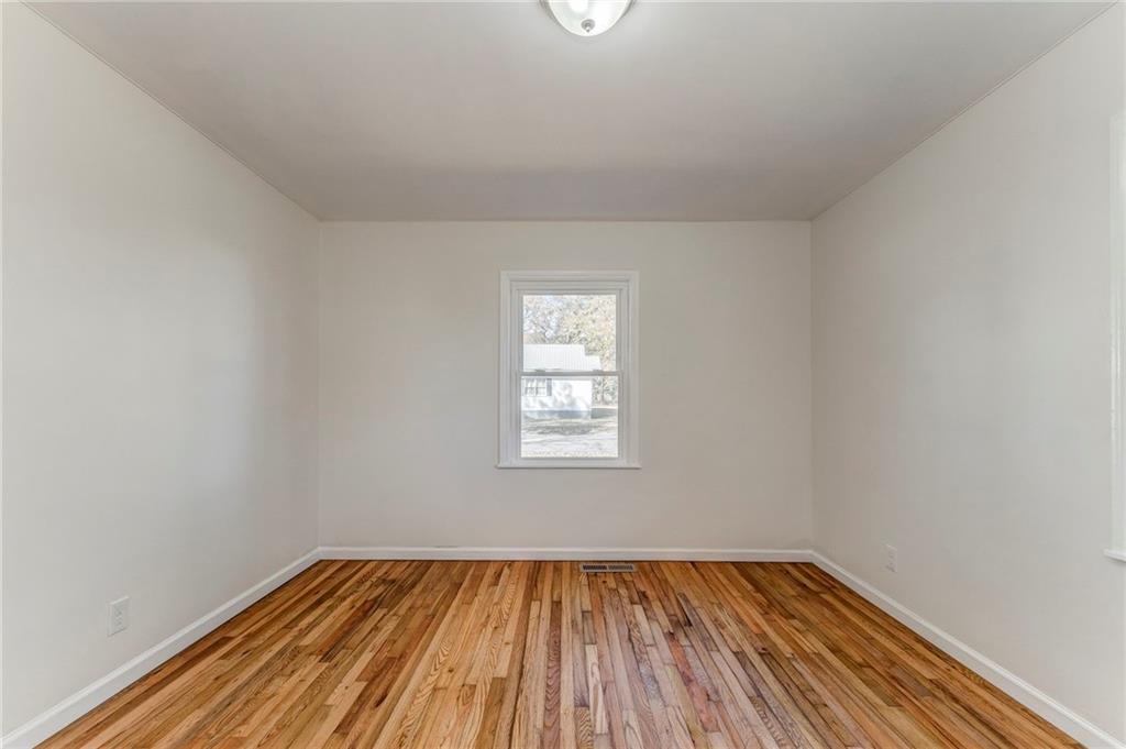 535 1st Street Northeast Rome, GA 30161 - Photo 19 of 34 a view of a room with wooden floor and window