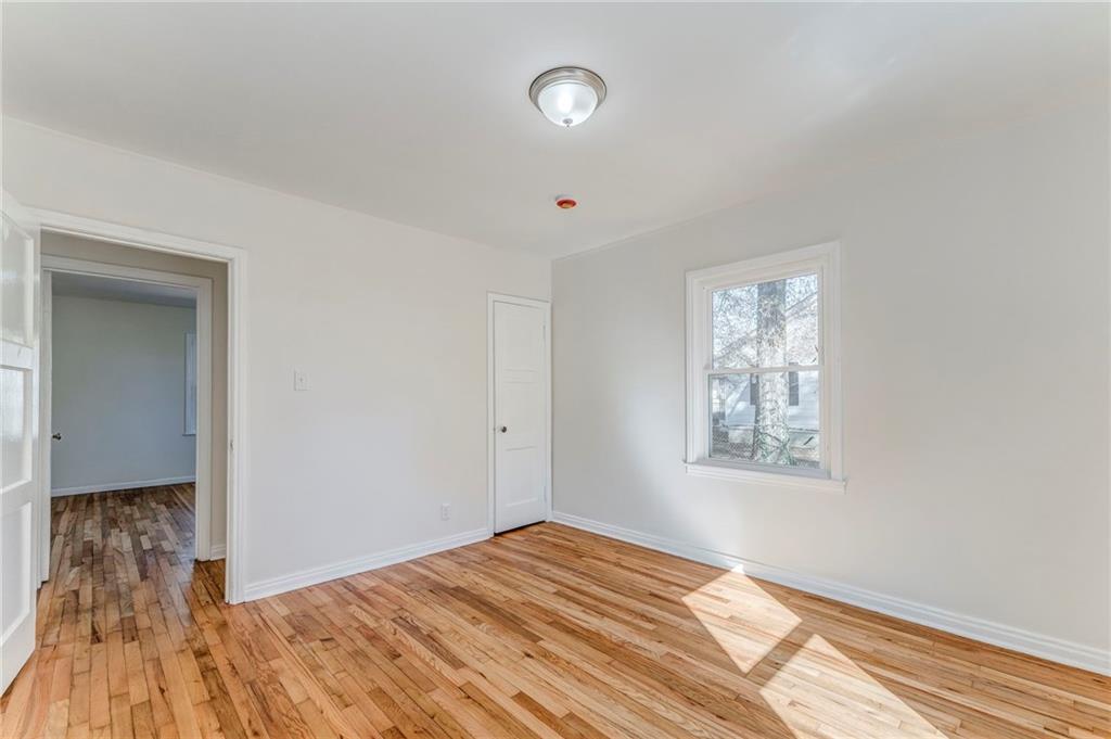535 1st Street Northeast Rome, GA 30161 - Photo 20 of 34 a view of a bedroom with wooden floor
