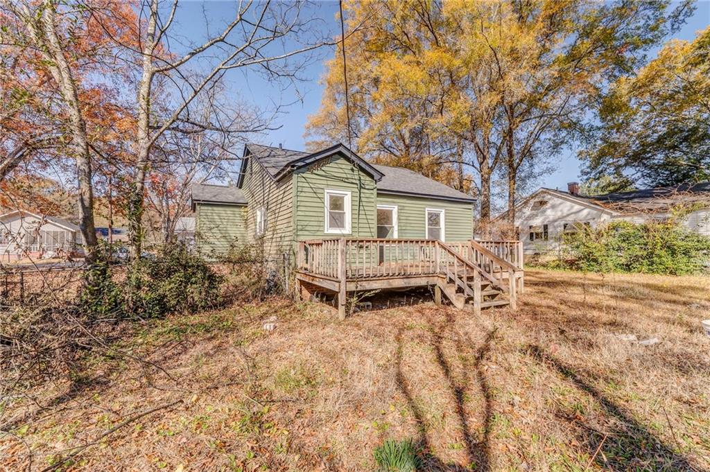 535 1st Street Northeast Rome, GA 30161 - Photo 27 of 34 a white house that has a tree in front of it