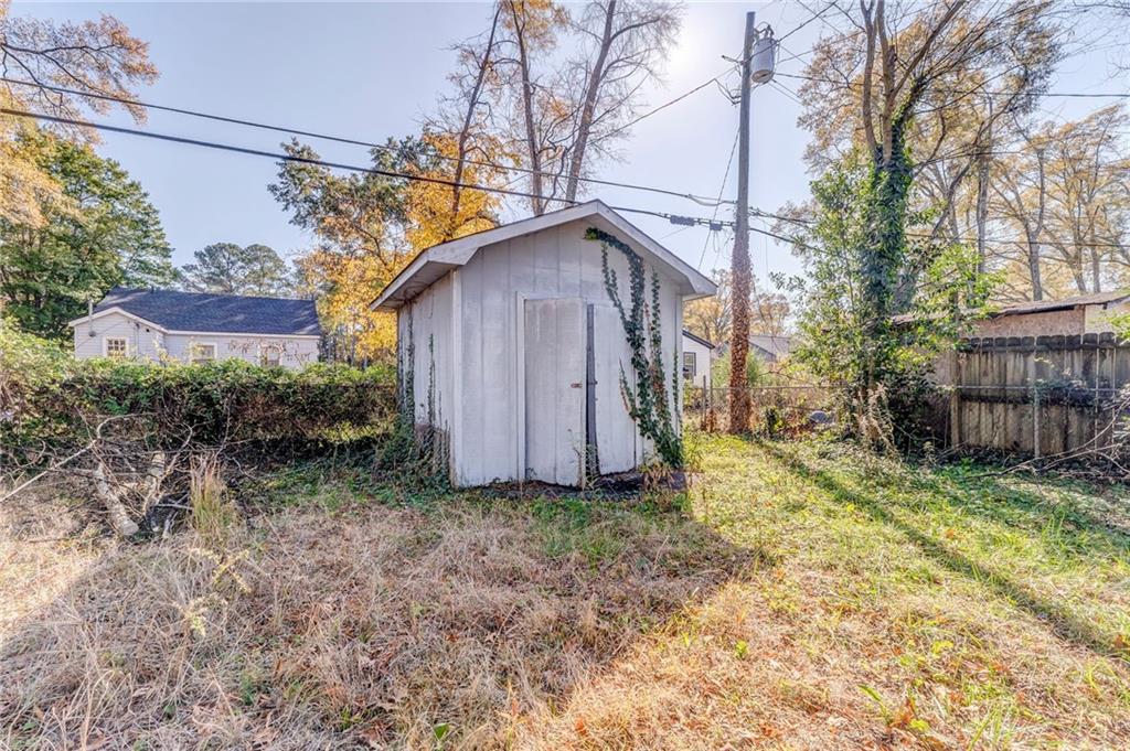 535 1st Street Northeast Rome, GA 30161 - Photo 28 of 34 a view of a backyard with plants and large trees