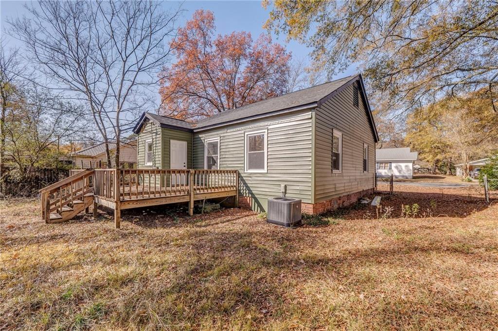 535 1st Street Northeast Rome, GA 30161 - Photo 29 of 34 a view of a house with a yard and sitting area