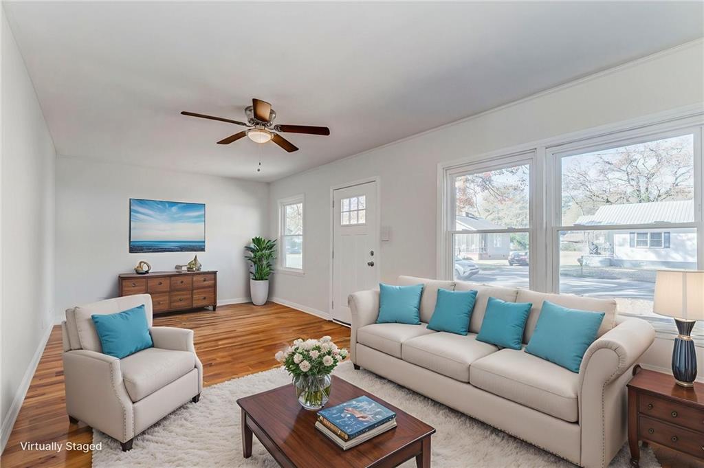 535 1st Street Northeast Rome, GA 30161 - Photo 4 of 34 a living room with furniture ceiling fan and a window