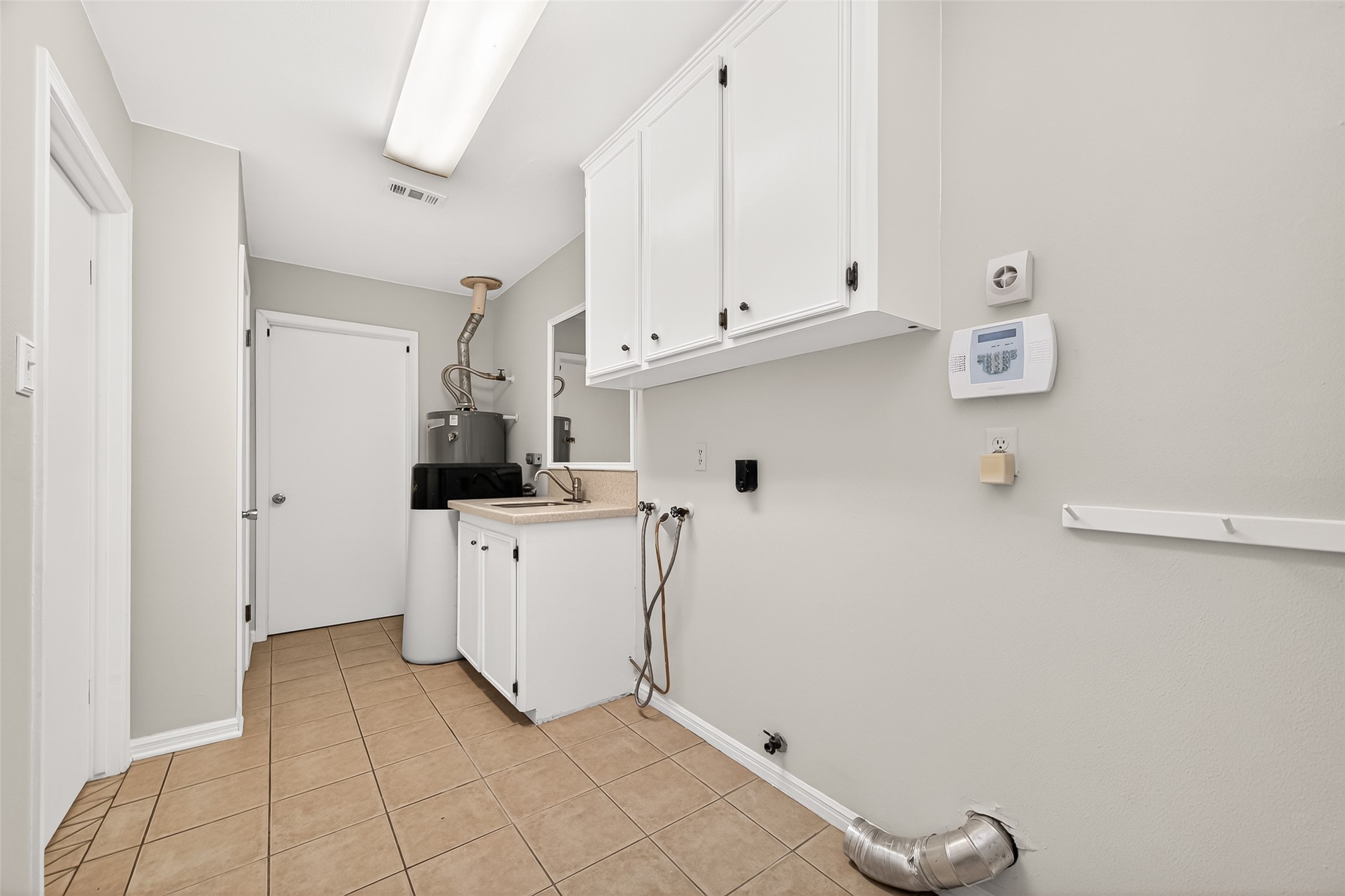 17810 Abby Lane Spring, TX 77379 - Photo 23 of 50 Laundry Room with sink and water softener