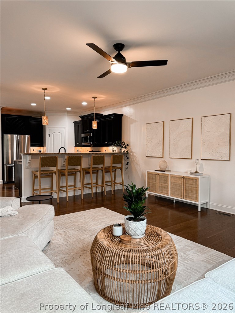 93 Falcon Ridge Drive Spring Lake, NC 28390 - Photo 17 of 50 a living room with furniture kitchen view and a potted plant