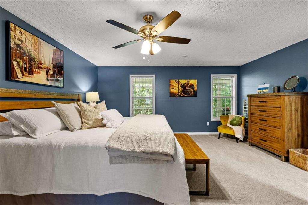 128 Byrom Road Senoia, GA 30276 - Photo 26 of 83 a bedroom with furniture and wooden floor