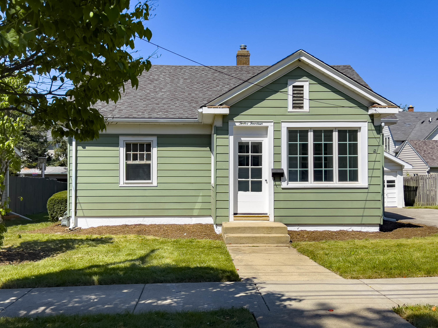 1214 Indiana Avenue St. Charles, IL 60174 - Photo 2 of 19 a front view of a house with a yard