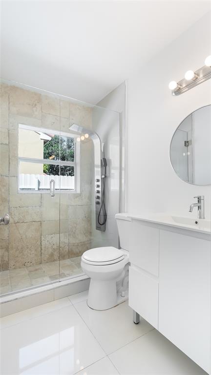 1811 Southwest 124th Way Miramar, FL 33027 - Photo 16 of 28 a bathroom with a sink a toilet and shower
