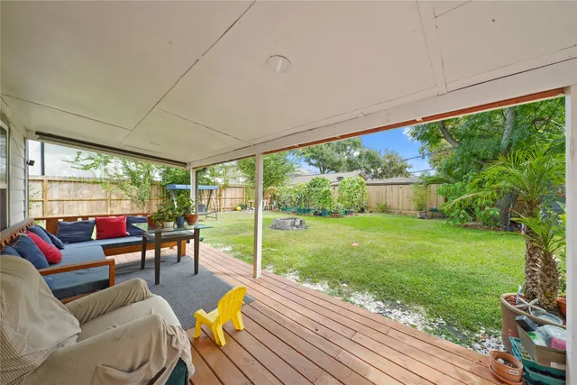 a living room with furniture and a garden