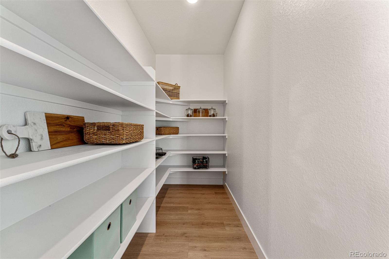 39782 Penn Road Elizabeth, CO 80107 - Photo 17 of 37 a view of a hallway with wooden floor and closet