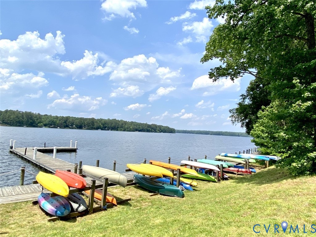 13402 Poplar Grove Place Midlothian, VA 23112 - Photo 46 of 52 a view of a lake with lawn chairs and a big yard